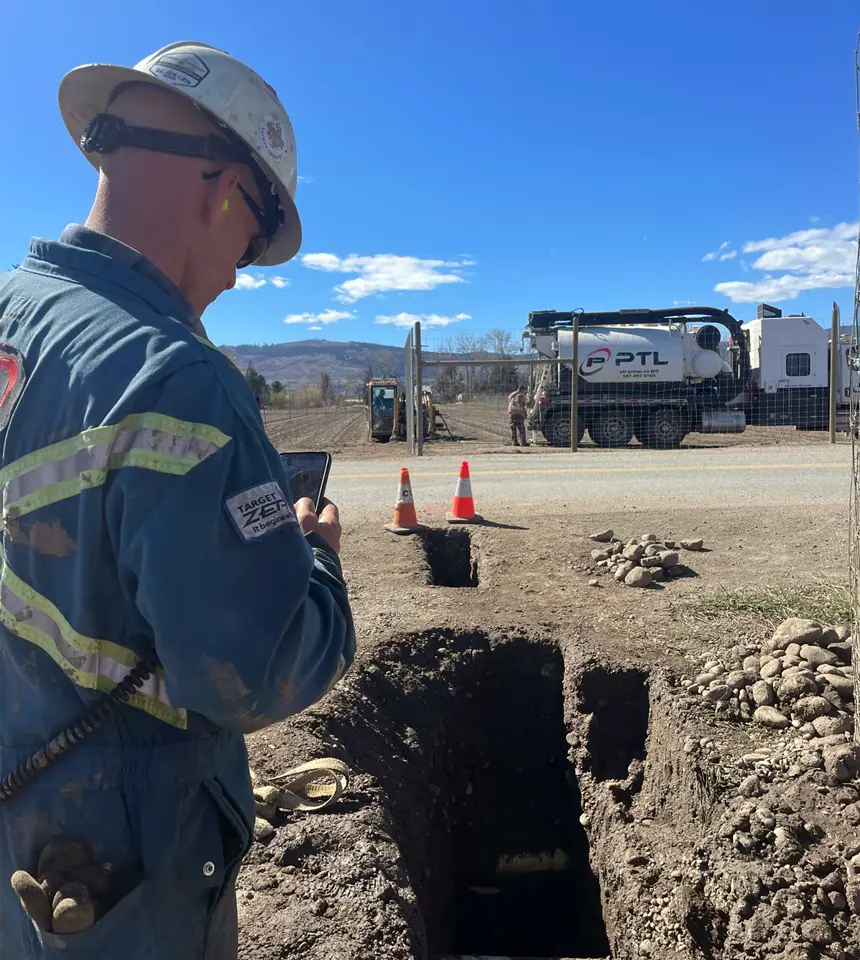 Crew member assessing site work in BC Okanagan for HDD drilling and hydrovac